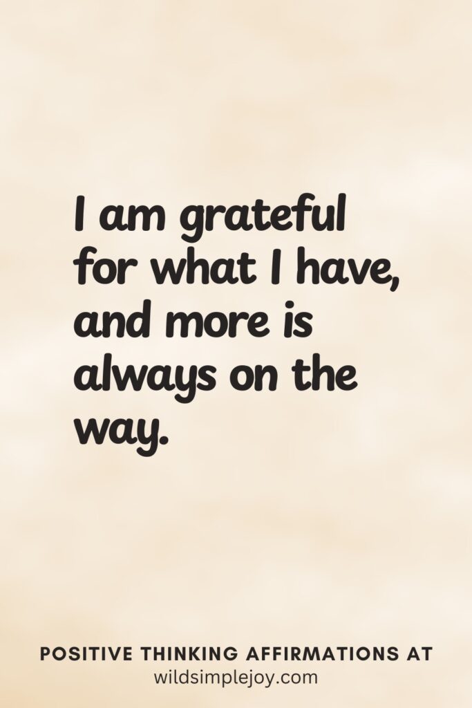 Vertical pin image on cream background with text overlay, I am grateful for what I have and more is always on the way! Positive Thinking Affirmations at wildsimplejoy.com