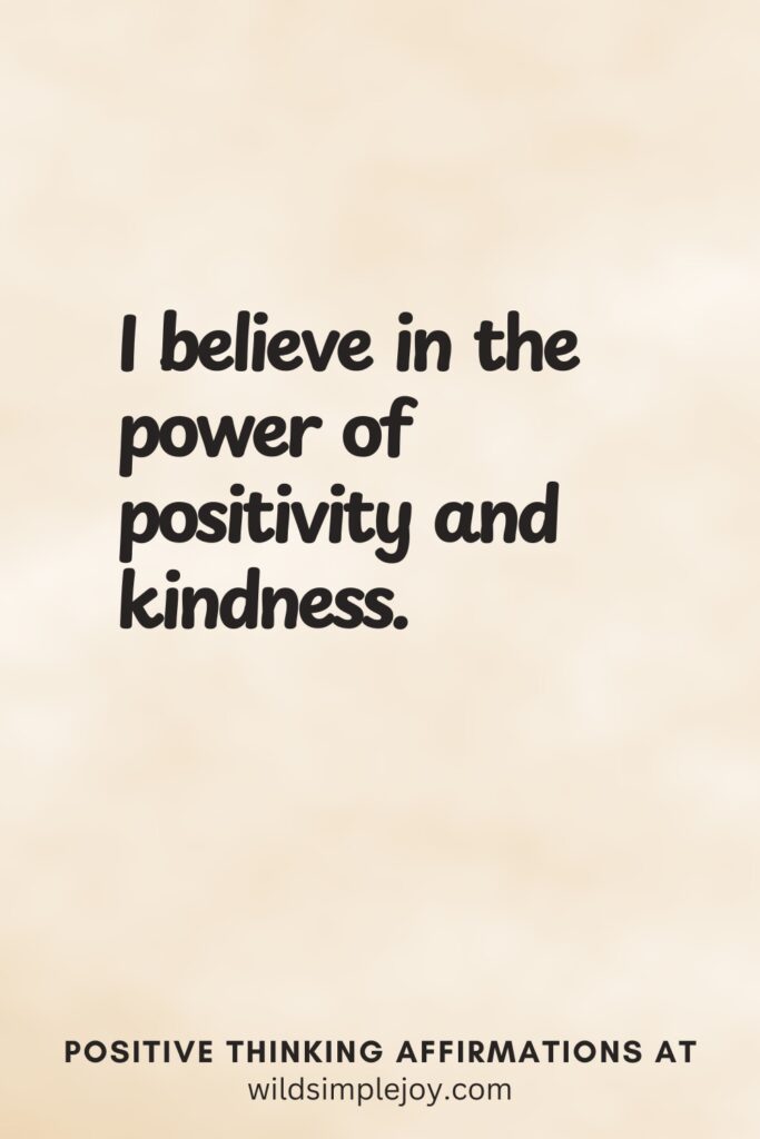 Vertical pin image on cream background with text overlay, I believe in the power of positivity and kindness. Positive Thinking Affirmations at wildsimplejoy.com