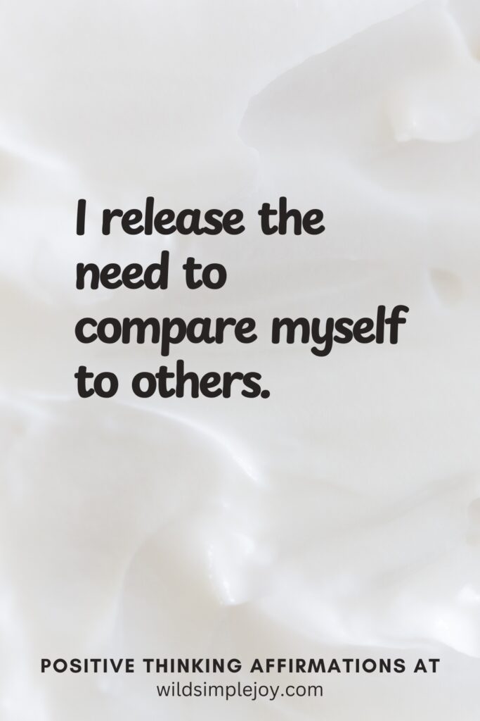 Vertical pin image on cream background with text overlay, I release the need to compare myself to others. Positive Thinking Affirmations at wildsimplejoy.com