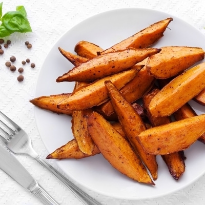 Swap out fries for sweet potato fries baked in the oven at home