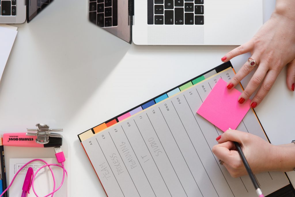 Woman is writing down her health affirmations that work!