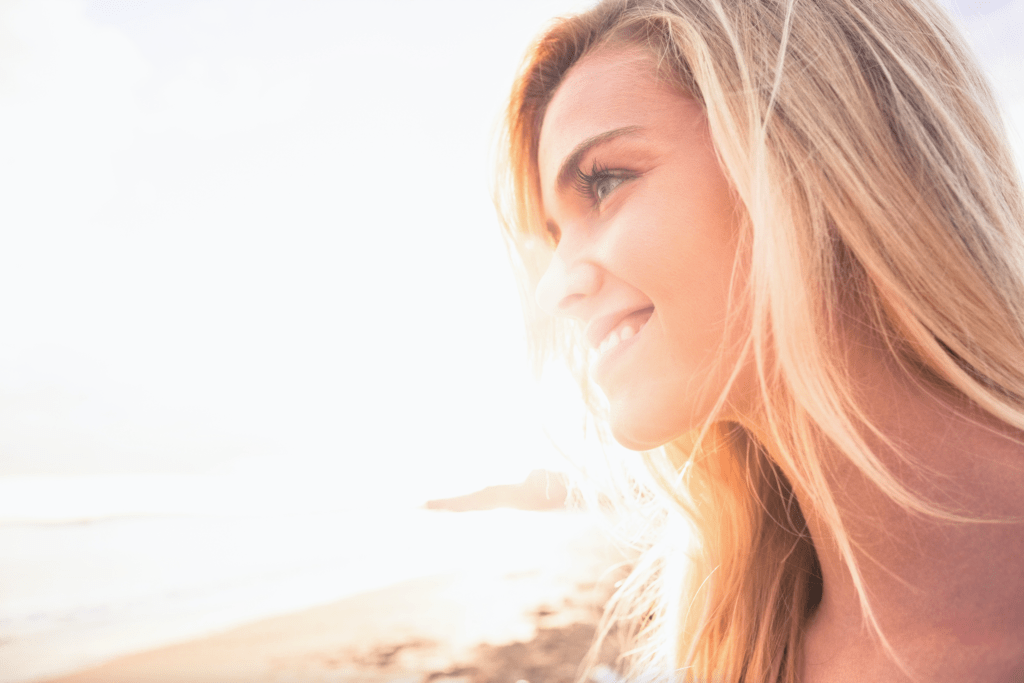 Woman joyful and smiling because she knows how do affirmation work for positivity in her life.