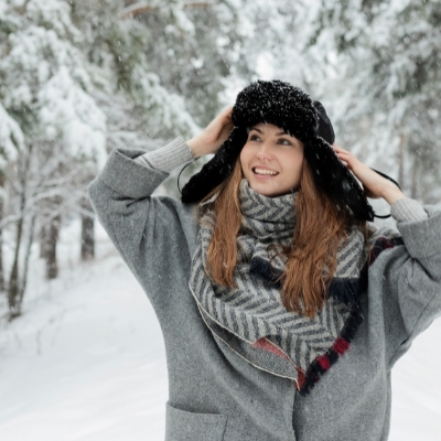 Woman feeling positive using affirmations in the snow