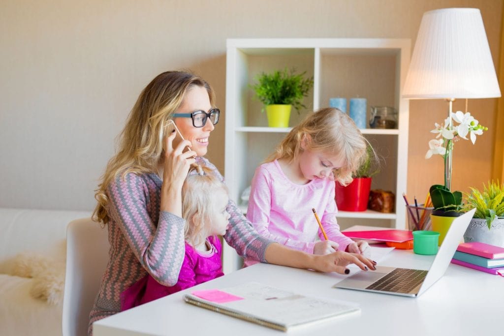 Woman weighing the pros and cons of becoming a stay at home mom.