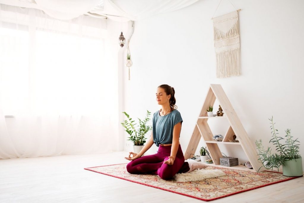 Woman meditating on patience affirmations.