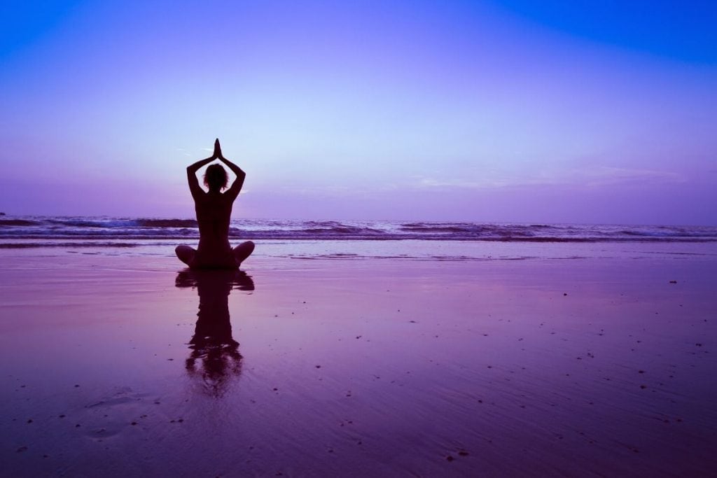 Woman meditating to positive spiritual affirmations.