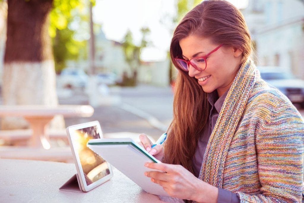 Woman writing guest post submission women's blog for Wild Simple Joy