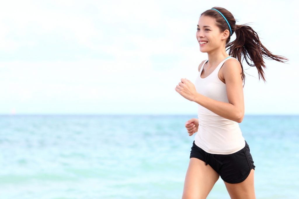 Health affirmations for fitness and healthy living. Woman running.