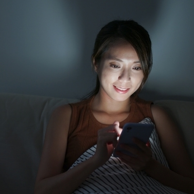 Woman on phone at night