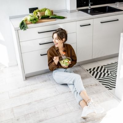 Woman manifesting a new kitchen floor