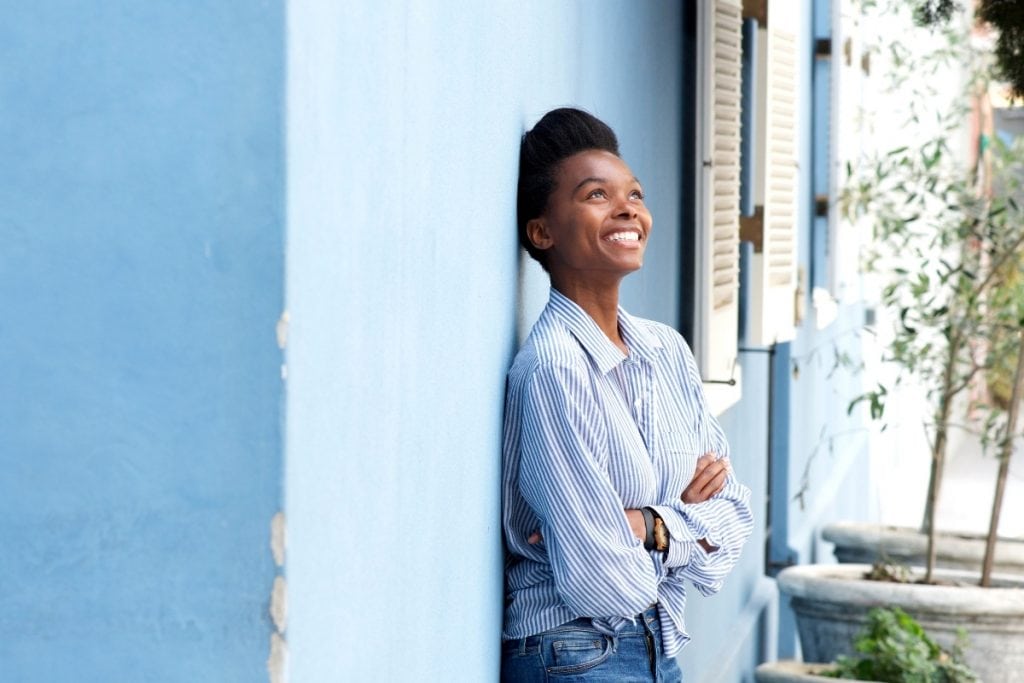 Self-confident woman has been practicing positive self worth affirmations.