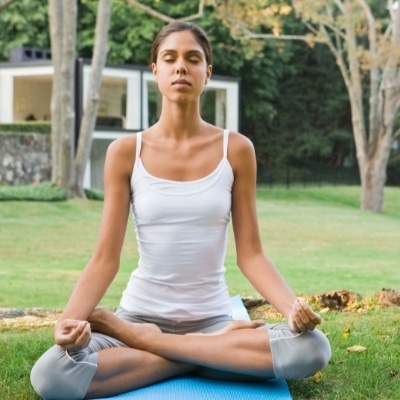 Woman meditating. Meditation is a proven way to find peace of mind and happiness