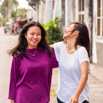 Two female friends experiencing unconditional love and gratitude