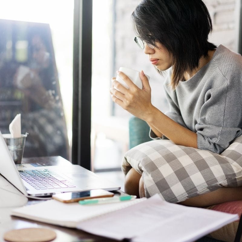 Focused woman working at home is 100% committed to her goals.