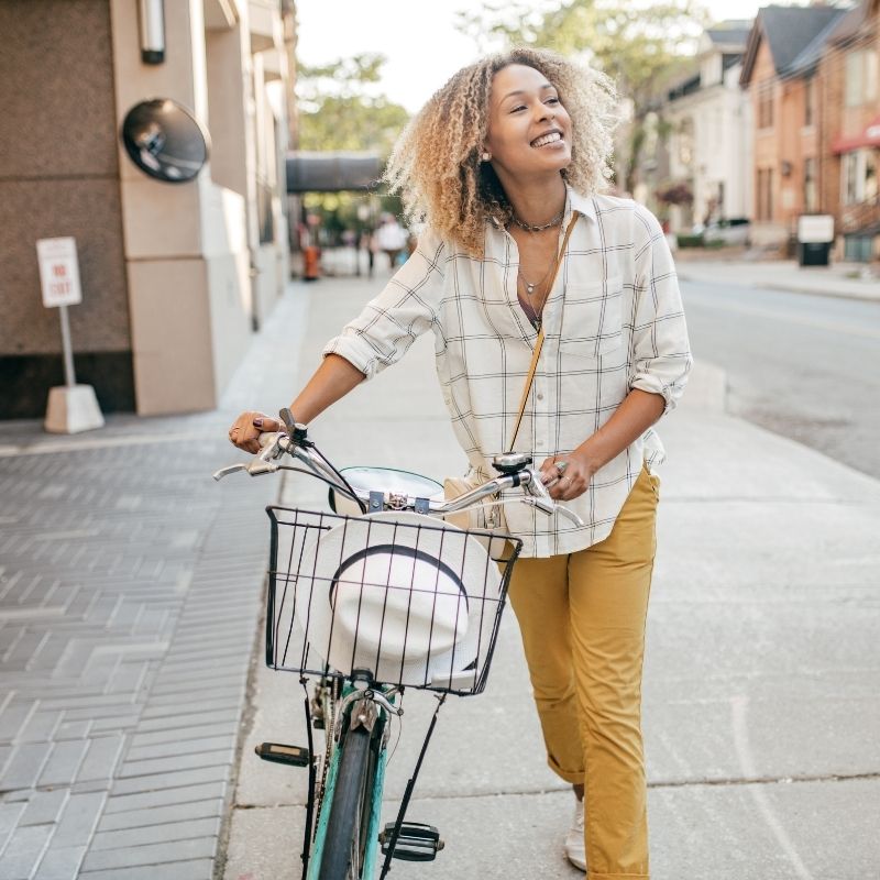 Woman riding a bike in the city.