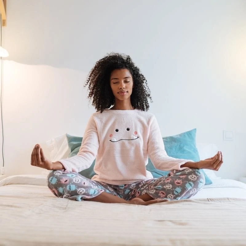 Young woman practicing meditation.
