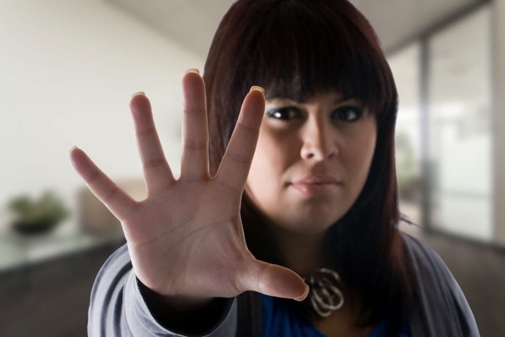 Woman setting healthy boundaries at work and saying no