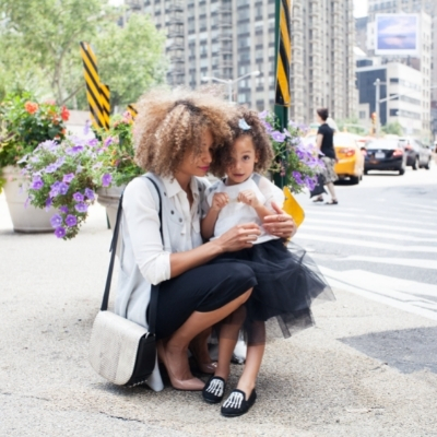 Know that the transition back to work will take time. Woman with young daughter