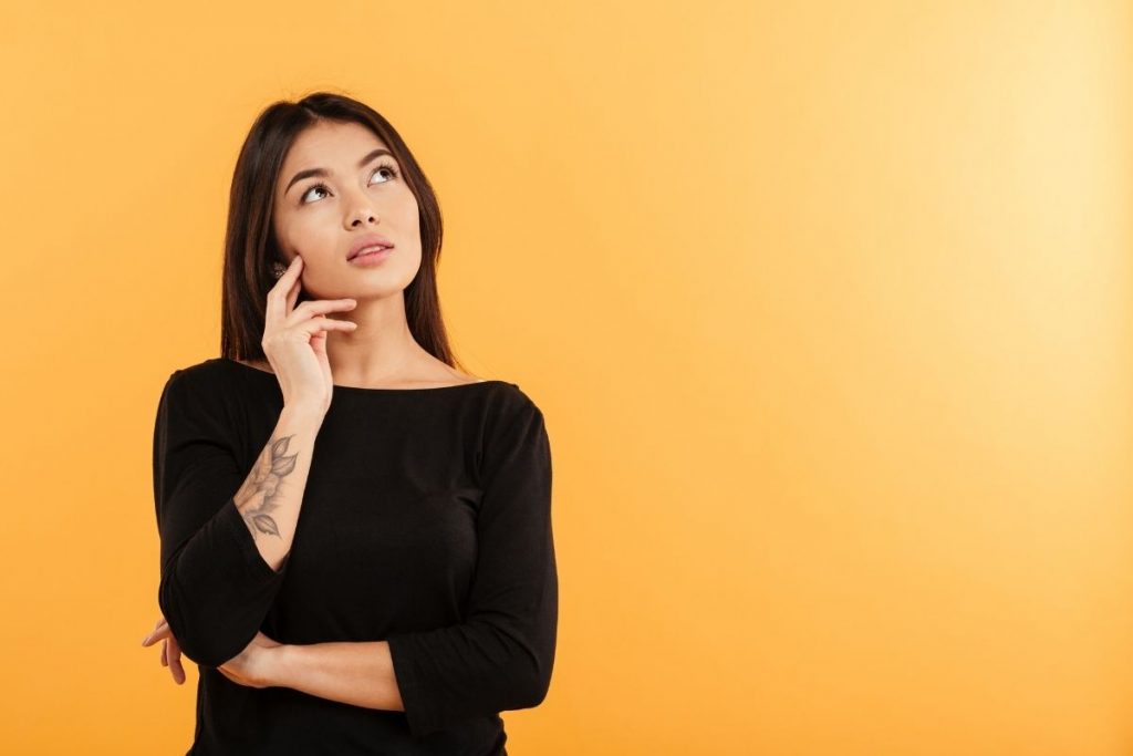 Woman hearing her internal narrative inside her head.