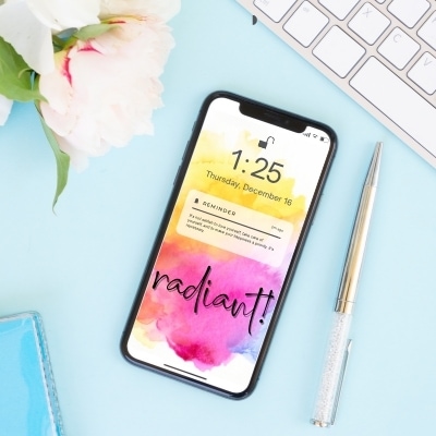 Cell phone with the word Radiant. Putting your word for the year as your phone background is a great way to stay focused on it