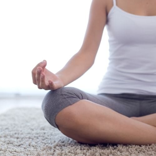 Woman meditating to find spiritual enlightenment