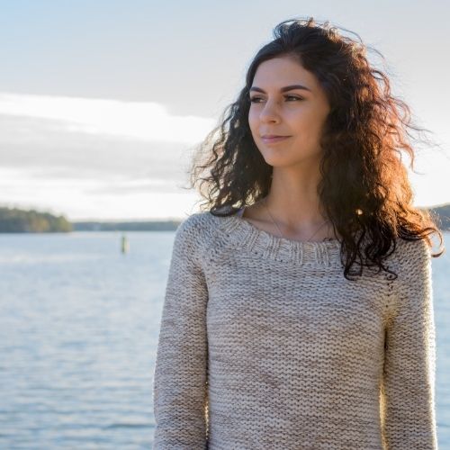 Woman thinking, staring out at nature