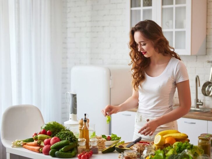 Woman in kitchen preparing a healthy meal knows how to nourish your body