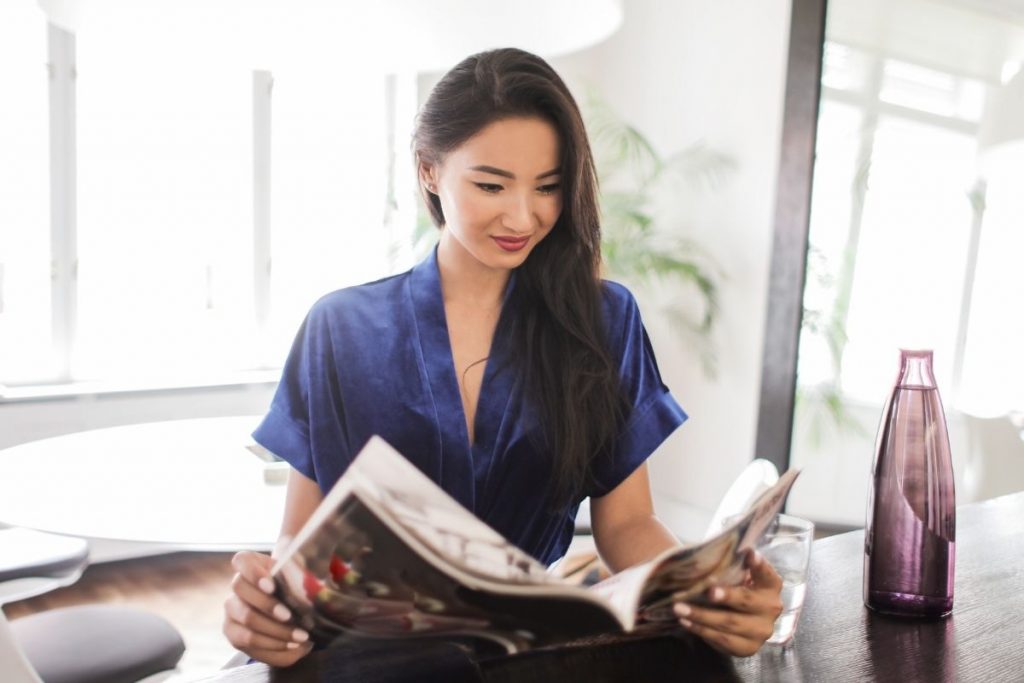 Woman reading and practicing positive thinking affirmations for a powerful mindset