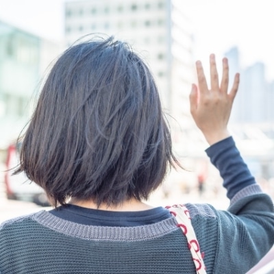 Woman saying hello. Greeting strangers on the street or at the store in a safe environment is an excellent way to increase your self confidence