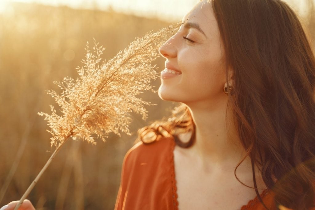 Woman smiling at sunset. Life is what you make of it, so make it amazing!