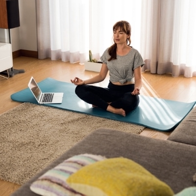 Mother practicing self care by doing yoga