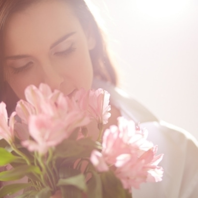 Woman smelling flowers