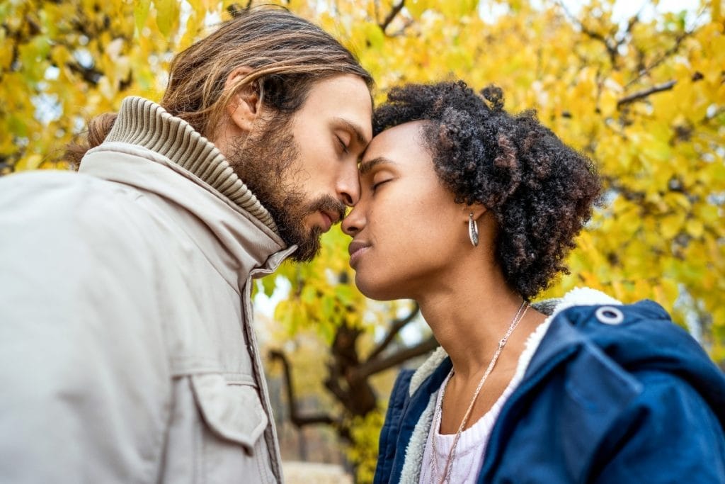 Couple lovingly touching foreheads