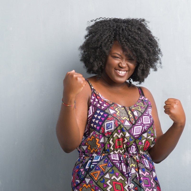 Feminism, woman standing strong with fists up