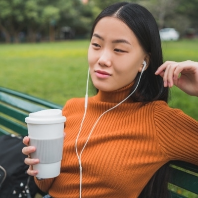 Woman listening to music outside