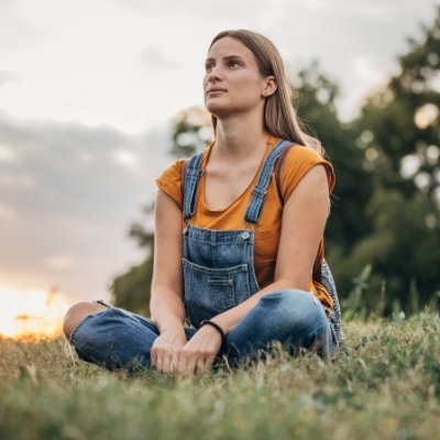 Woman quietly and mindfully observing nature