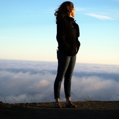 Believe in yourself! Life is what you make of it, so make it good! Woman standing on a mountain