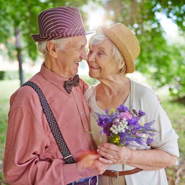 Old couple smiling at each other