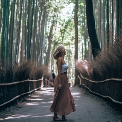 Woman on a path considering how far you've come