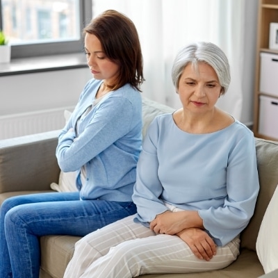 Woman exhibiting signs of conditional love from parents to adult daughter.