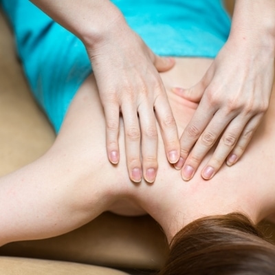 Mother getting a massage and investing in self care