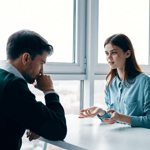 Woman calling out a coworker who has said something offensive