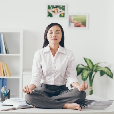 Woman meditating at work