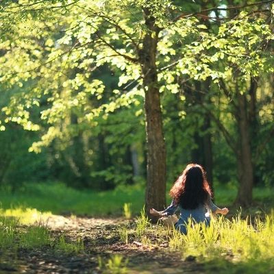 Woman meditating in nature