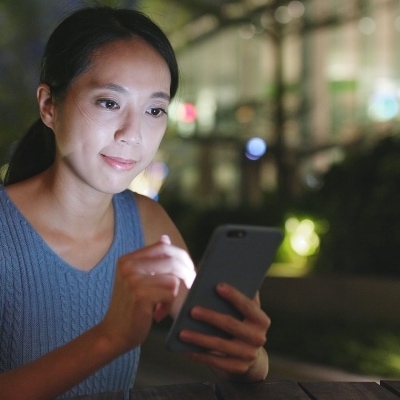 Woman on her phone. Putting down your phone can drastically help mothers