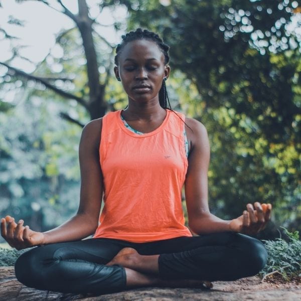 Woman practicing meditation to help her live life to the fullest
