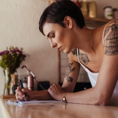 Woman writing in journal