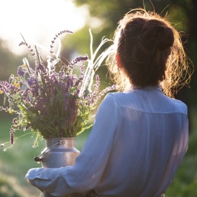 Woman with lavender practicing self-care