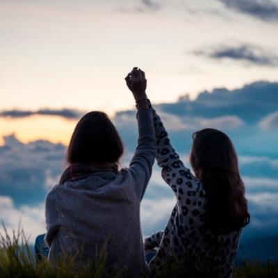 Women holding hands. Spiritual well being helps to enhance our interbeing and connectedness