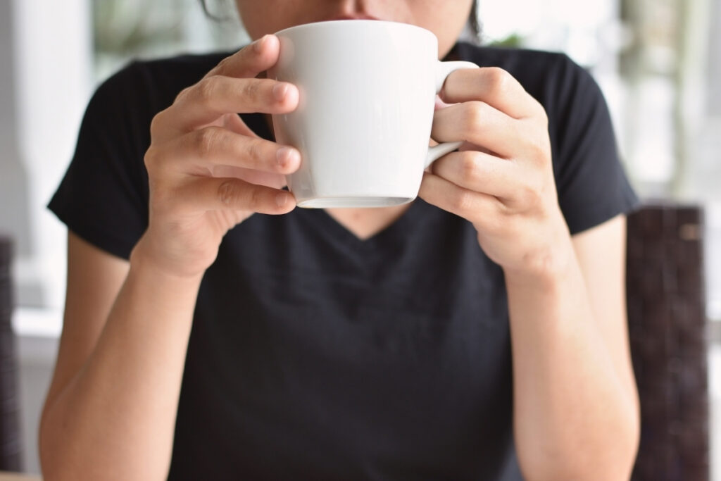 Woman drinking a hot drink in the morning